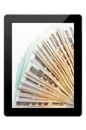 Tablet pc with bank note isolated on white bakgroundの写真素材