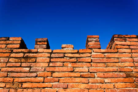 ancient brick fortress wall on blue sky