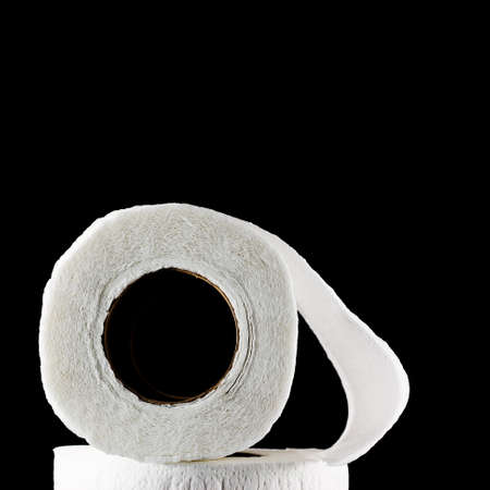 toilet paper isolated on black backgroundの写真素材