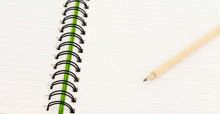 pencil on open white paper note bookの写真素材