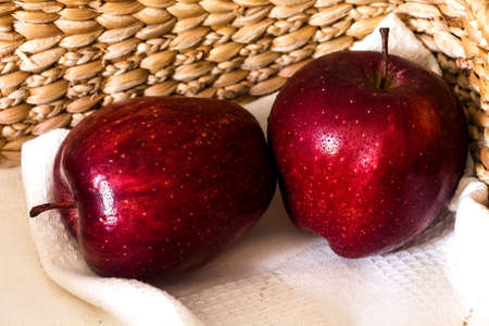 fresh apple and napkin in basketの写真素材