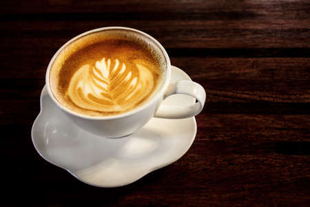 Flat white coffee with latte art.