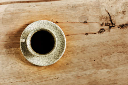 Coffee cup on wood table with copy space.の写真素材