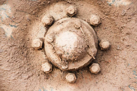 Close up to side of muddy wheelsの写真素材
