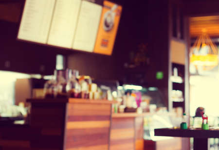 Blurry of coffee shop interior design. (Vintage process tone)の写真素材