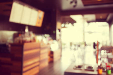Blurry of coffee shop interior design. (Vintage process tone)の写真素材
