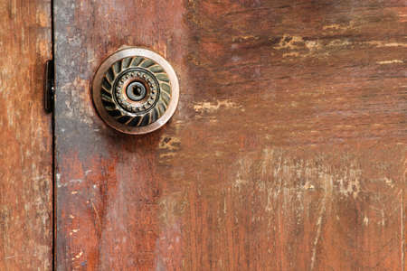 Door knob and a key hole with copy space for text.の写真素材