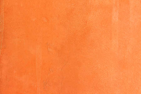 Orange concrete wall backgroundの写真素材