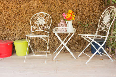 white chair with straw backgroundの写真素材