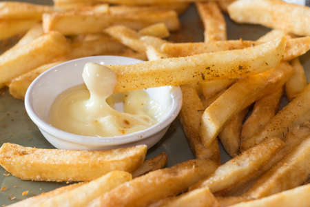 French fries. Potatoes cut into strips and deep-fried. Selective focus and close upの写真素材