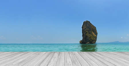 Koh Poda. Perspective white wood floor aginst Panorama seascape island in andaman, Krabi province, Thailand.の写真素材