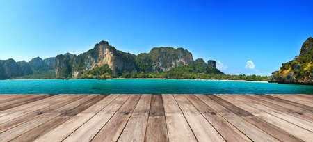 Perspective of wood terrace against beautiful seascape with free copy space use for background or backdrop.の写真素材