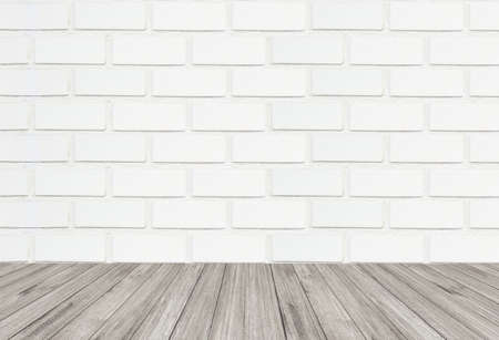 Abstract White brick wall texture background with wooden floorの写真素材