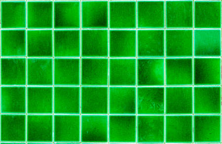 Green tile floor texture background in swimming poolの写真素材