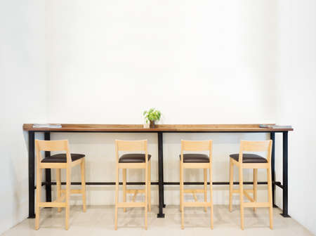 Counter in cafe bar with white wall empty space. の写真素材
