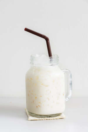 Closeup iced milk on white background.の写真素材