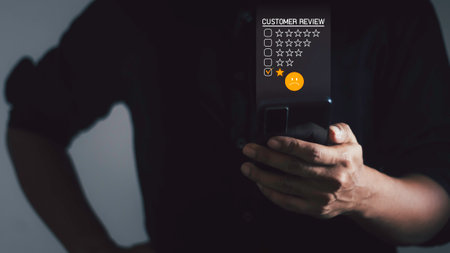 Customer Experience dissatisfied Concept, Unhappy Businessman Client with Sadness Emotion Face on smartphone screen, Bad review, bad service dislike bad quality, low rating, social media not good.の写真素材