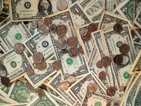 Scattered US tender containing bills and coins.の写真素材