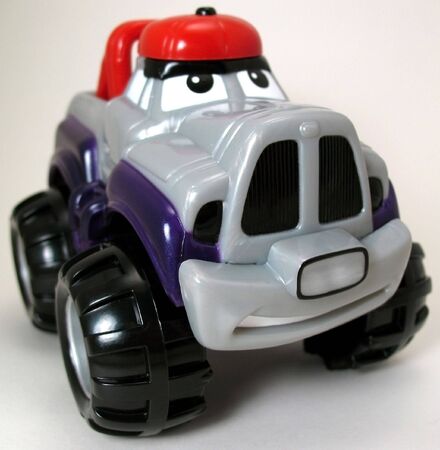 Photo of a personified toy truck on a white backround.の写真素材