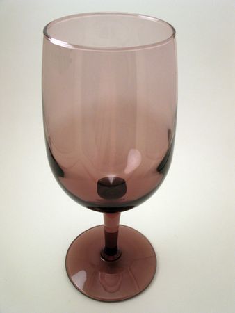 Empty wine glass that containes a purple tintの写真素材