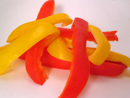 Sliced colorful peppers overlapping one another.の写真素材