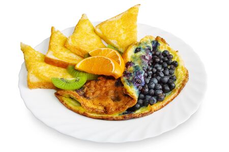 omelets with blueberries, toast with cheese, slices of oranges and kiwi fruit on a plate, isolated on whiteの写真素材