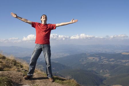 Happy man on the mountainの写真素材