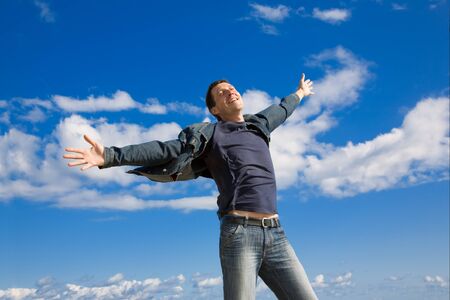 happy man on blue sky backgroundの写真素材