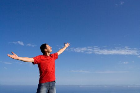 happy man on blue sky backgroundの写真素材