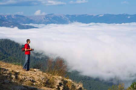 photographer with camera on Mountainsの写真素材