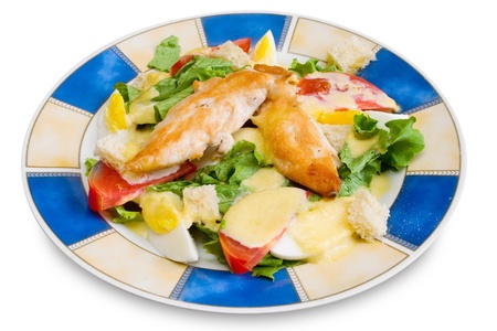 Chicken fillet with vegetables on plate isolated on whiteの写真素材