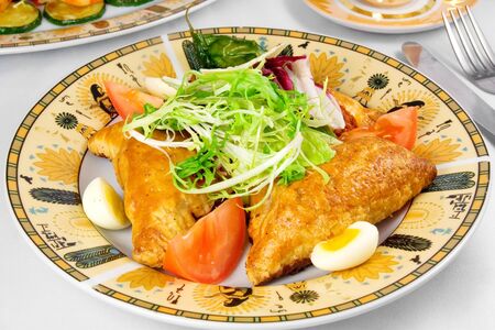 pies, vegetables on plateの写真素材