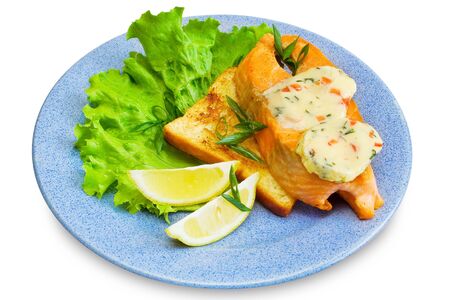 slice of salmon, toast, lemon, butter, lettuce on plate, isolatedの写真素材