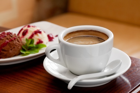 coffee cup and ice cream on restaurant tableの写真素材