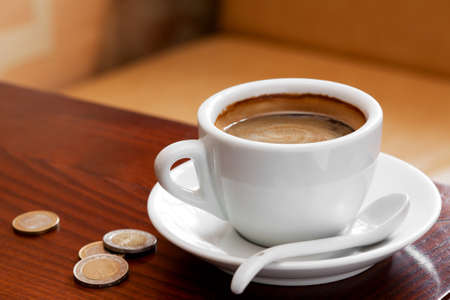 coffee cup and  Money on  cafe tableの写真素材