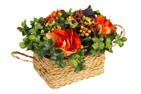 decorative basket with artificial flower, isolated on whiteの写真素材