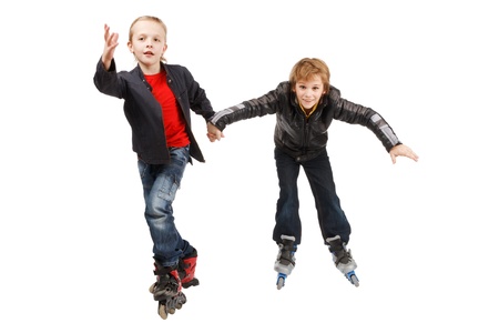 Two happy roller boys, isolatedの写真素材