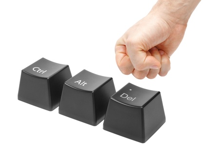 hand in a fist  push the delete key, button alt, ctrl, isolated on whiteの写真素材