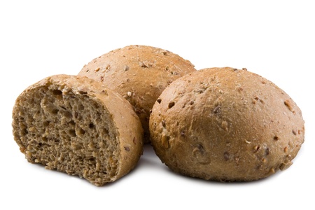 rye wholemeal buns with seeds on white backgroundの写真素材