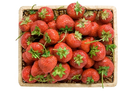 Fresh strawberries in basket isolated on whiteの写真素材