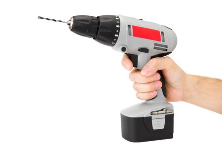 mans hand holding battery drill, isolated on whiteの写真素材