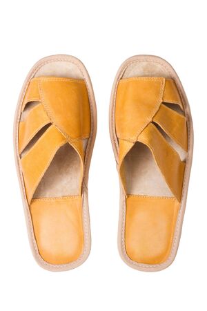 isolated yellow leather comfortable slippers, home shoes の写真素材