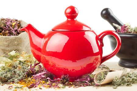 red teapot, mortar and pestle, sack with healing herbs, alternative medicine の写真素材