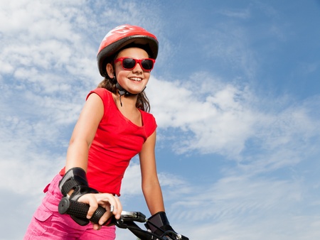 teenage girl on a bicycle の写真素材