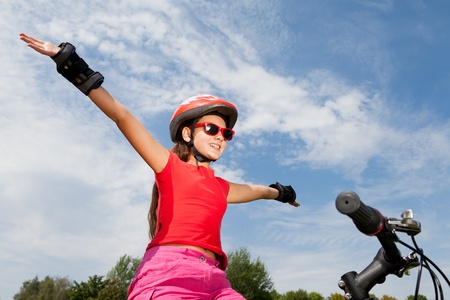 teenage girl on a bicycle の写真素材