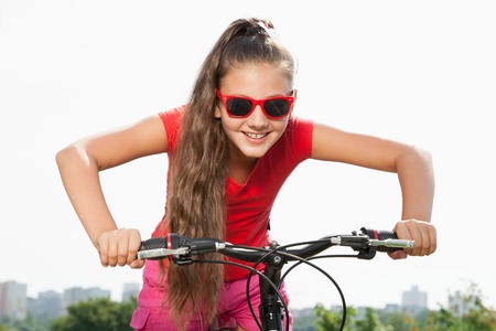 teenage girl on a bicycle の写真素材