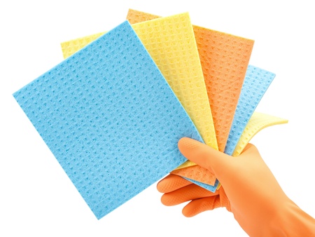 cleaning clothes  kitchen cellulose sponges  in hand in  protective glove on whiteの写真素材