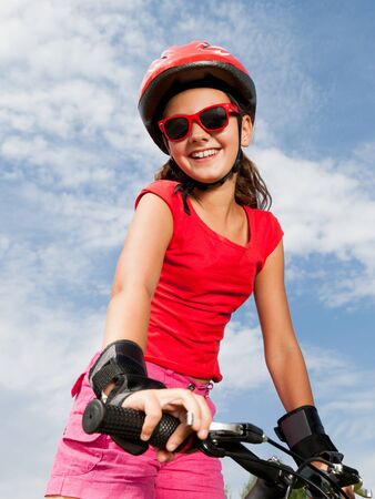 teenage girl on a bicycleの写真素材