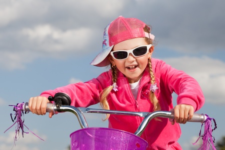 little girl on bicycleの写真素材