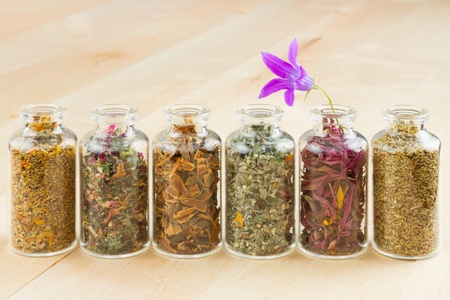 healing herbs in glass bottles, herbal medicineの写真素材